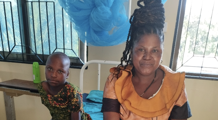 Two patients, a mother and child, at Bishop Edward Michaud Memorial Hospital